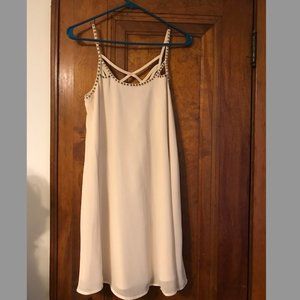 Cream colored dress with gold/brown beaded trimming and strappy back